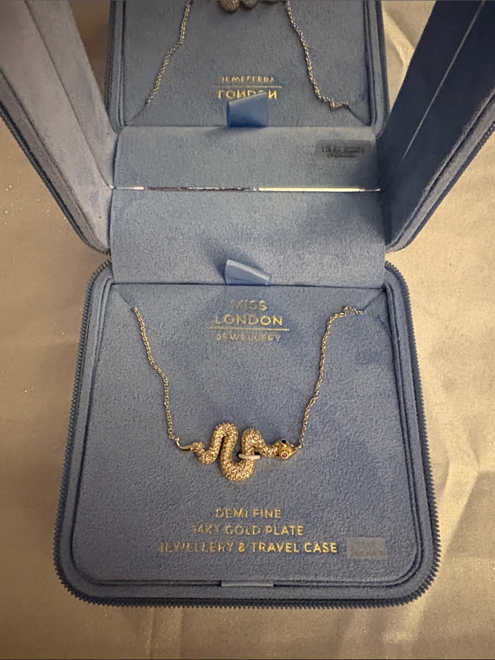 Miss London Gold Snake Pendant Necklace with Red Eye Accent